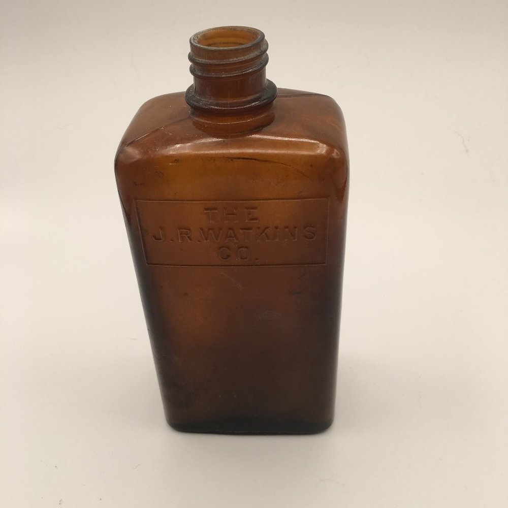 Empty vintage Watkins bottle